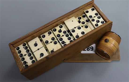 A set of Victorian bone and ebony dominoes and a treen barrel cased set of miniature dice